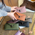Multi-color leather handbag for women with skirt fabric, metal buckle handle