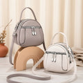 Women's leather circular zipper mini shoulder bag 636661