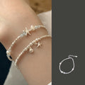 Women's beach vacation look from designermall paired with fashionable bracelet