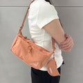 Kangol Essential X Small Crossbody Bag 3387 Peach Pink Slingshot